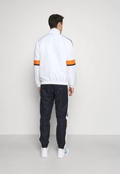 Sergio Tacchini NUSTRAT TRACKSUIT - Tracksuit - Dark Blue/orange -Sergio Tacchini Sales 0bc9b1205e424275bed915e9ad2d9238