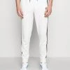Sergio Tacchini TRACK PANTS YOUNGLINE - Tracksuit Bottoms - Blanc De Blanc/night Sky -Sergio Tacchini Sales 3f64d7bba75f4c6d8d8fd7cbd631013a