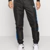 Sergio Tacchini FASCIA PANTS - Tracksuit Bottoms - Black/lapis Blue -Sergio Tacchini Sales 4117382ca5004087b72c211def616dbc