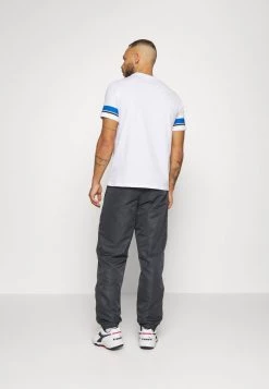 Sergio Tacchini CARSON PANTS - Tracksuit Bottoms - Ebony/white -Sergio Tacchini Sales 45b886a372aa4887bef5e30df8dc183d