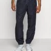 Sergio Tacchini CARSON PANTS - Tracksuit Bottoms - Navy/red -Sergio Tacchini Sales 58f066c4173c463cbb862fad06234198